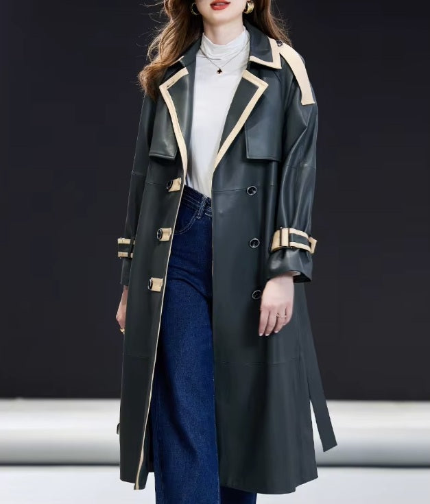 Women's Leather Outer Space Trench. Model walks forward, showcasing the coat’s effortless drape and disciplined yet fluid design. Borcelleclothes.