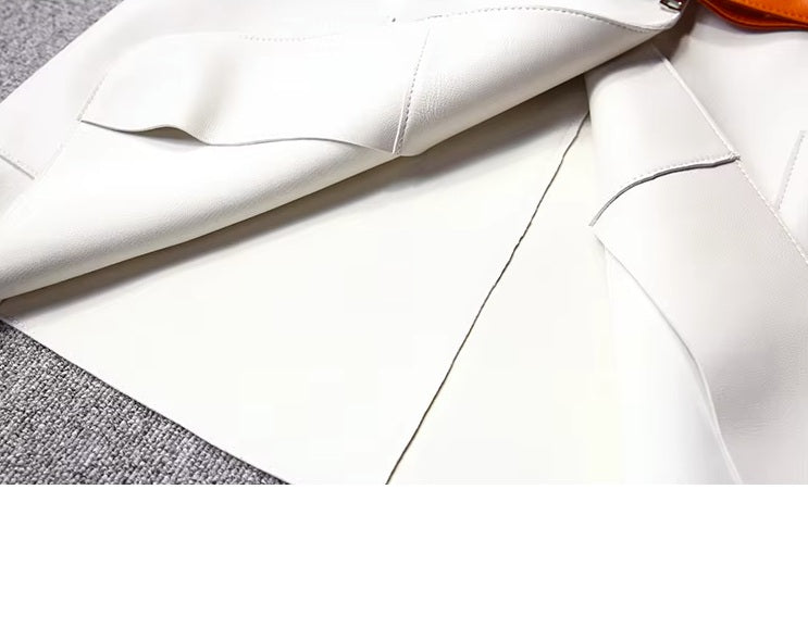 Women's Leather Wrap Vest in Magnolia. A detailed view of the folded bottom section, highlighting the precision of the leather’s construction and its sculpted drape. Borcelleclothes.