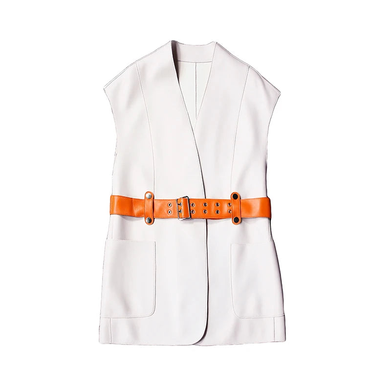 Women's Leather Wrap Vest in Magnolia. Full front view, displaying the clean lines, bold contrast belt, and architectural wrap silhouette. Borcelleclothes.