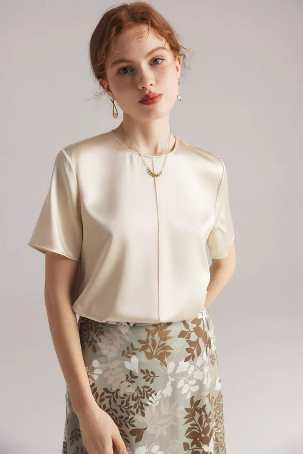 Model in Lemon Grass silk skirt standing with arm behind back, showing waistline and calm silhouette. From Borcelleclothes.