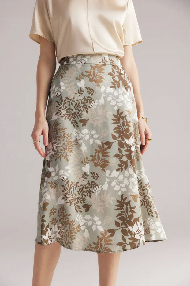 Side angle of model’s foot in motion while wearing Lemon Grass silk skirt, showing natural drape. From Borcelleclothes.