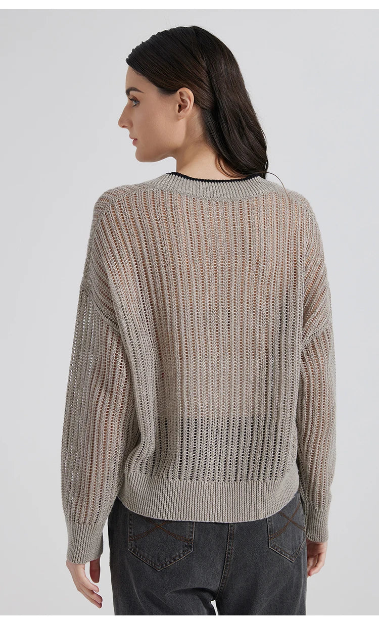 Back view of the Tide cardigan, showing vertical lace pattern, relaxed shoulder line, and refined linen structure. From Borcelleclothes.
