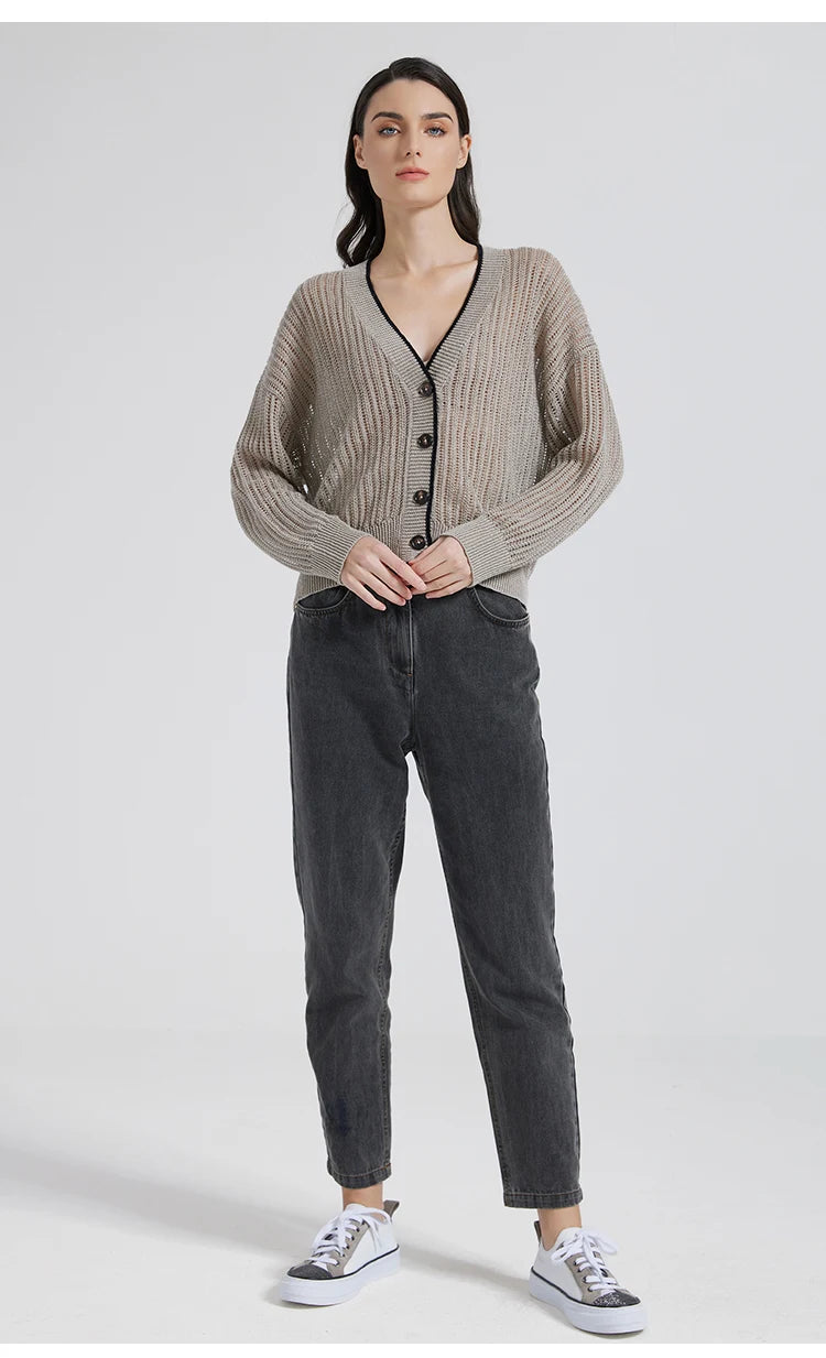 Full-length view of a model in a Tide cardigan in linen, softly structured silhouette with architectural lace and contrast accents. From Borcelleclothes.