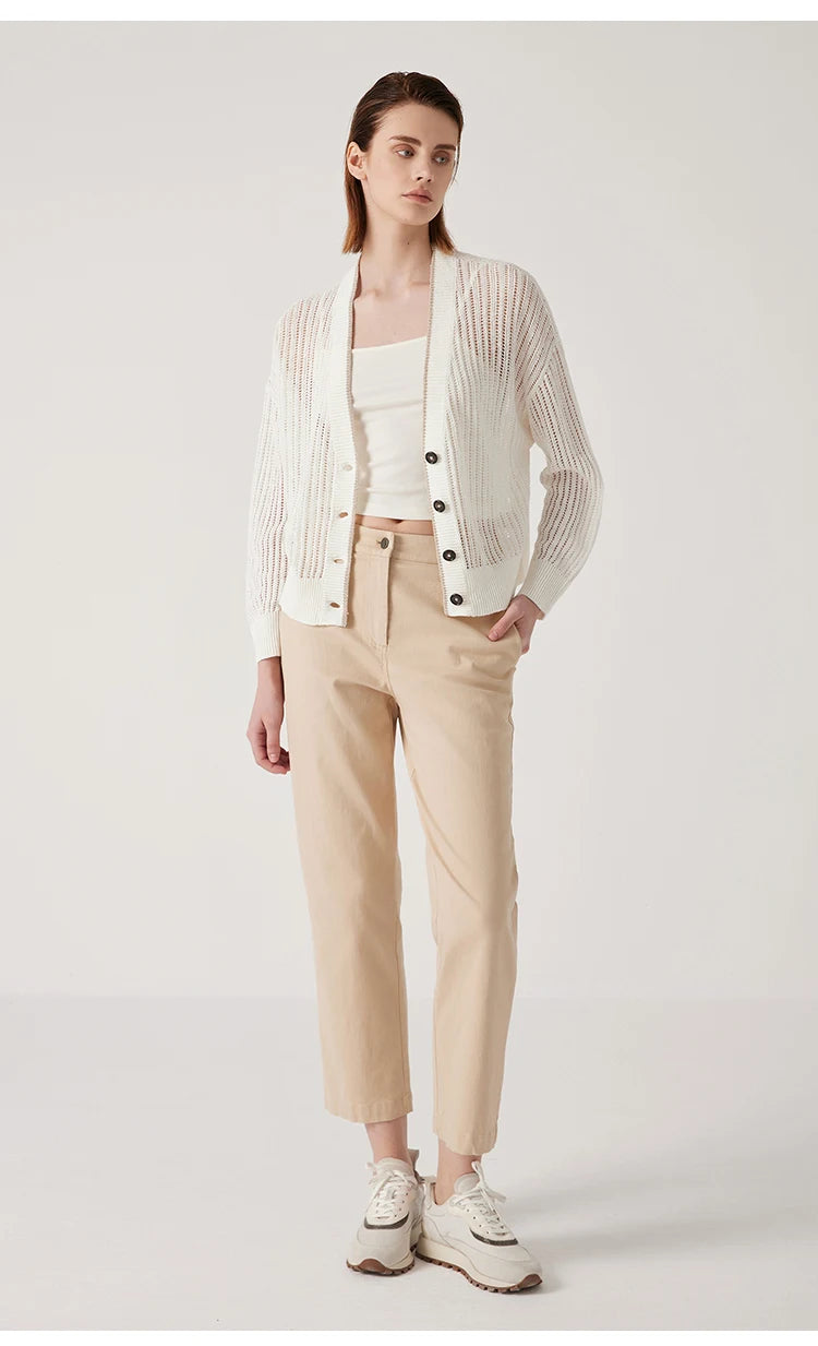 Full-length view of a model in Wild Sand linen cardigan, featuring open front and lightweight lace knit creating a long, vertical silhouette. From Borcelleclothes.