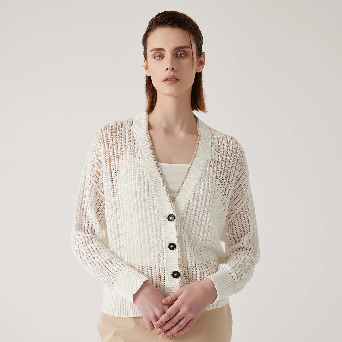 Women's Linen cardigan in Wild Sand with vertical lace knit, dropped shoulders, contrast buttons, and ribbed trim—lightweight, structured, and refined. From Borcelleclothes.