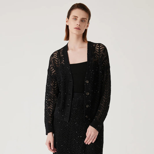 Women's linen lace cardigan in Onyx, featuring a flowing openwork pattern, ribbed cuffs, and a wide hem for gentle structure. From Borcelleclothes.