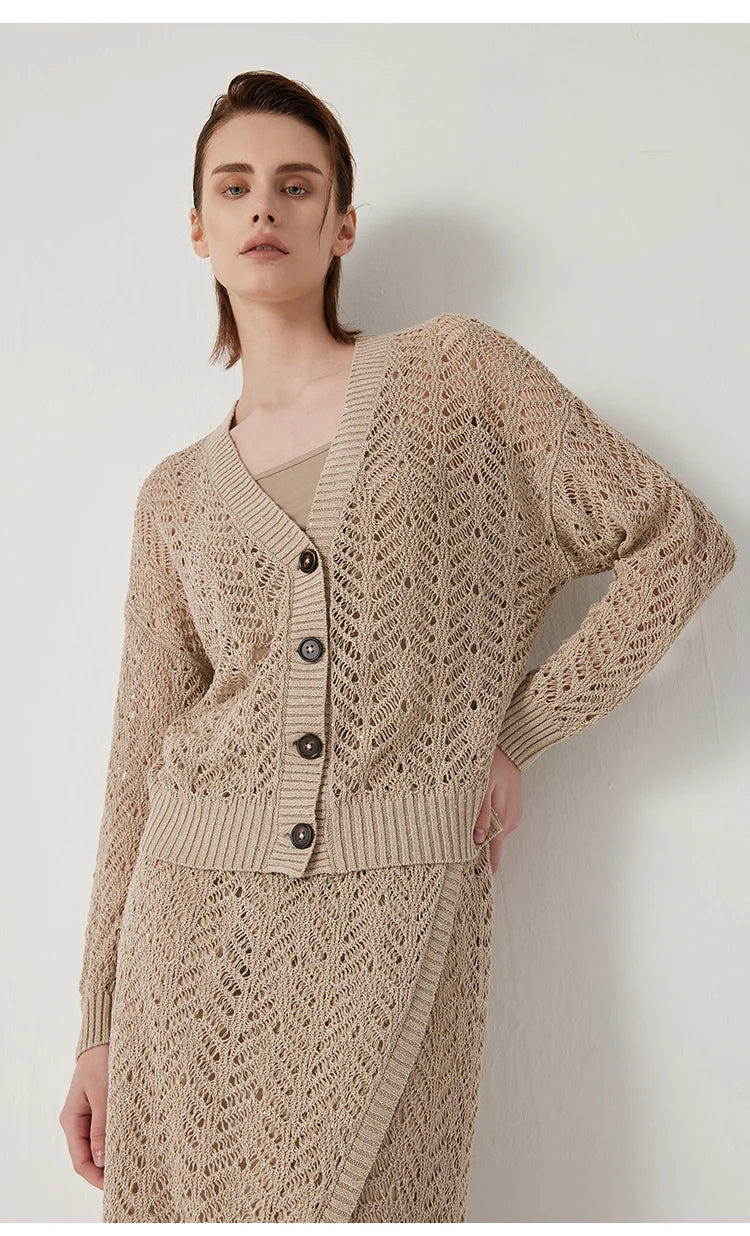 Model in Vanilla linen lace cardigan with hand on hip, revealing side profile and lace detail. From Borcelleclothes.