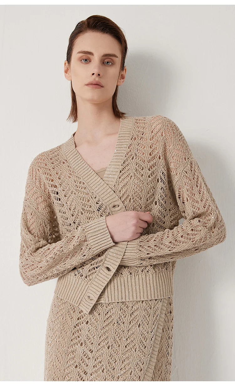 Model gently wraps the unbuttoned Vanilla cardigan around herself, evoking intimacy and comfort. From Borcelleclothes.
