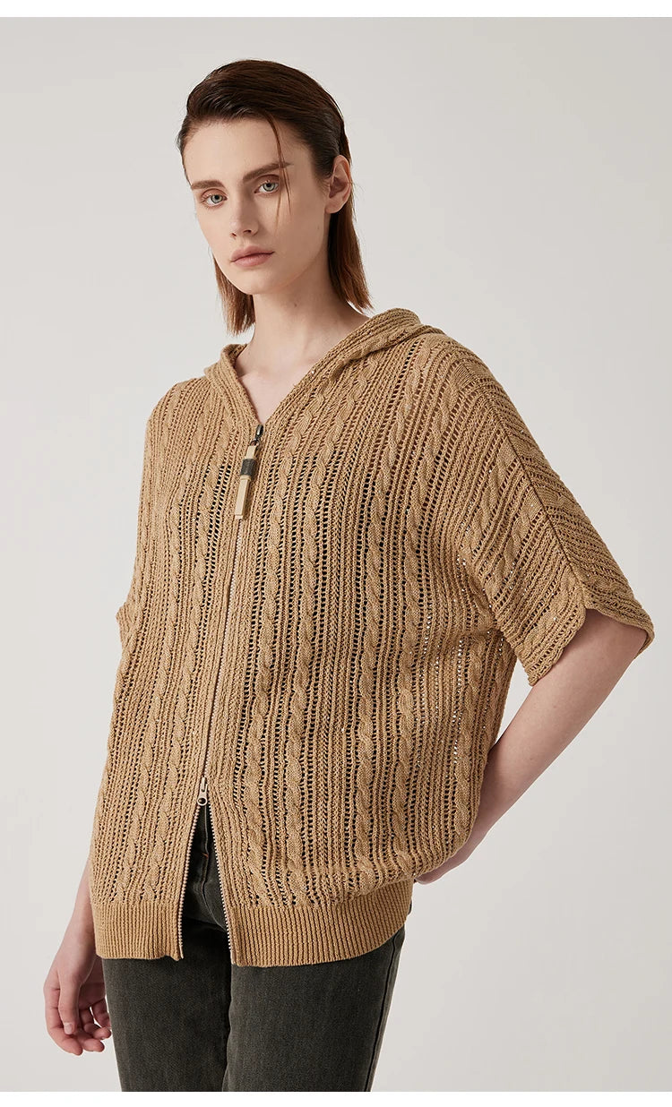 Woman in mocha lace hoodie with one hand behind her back, revealing the airy texture and sleeve details. From Borcelleclothes.