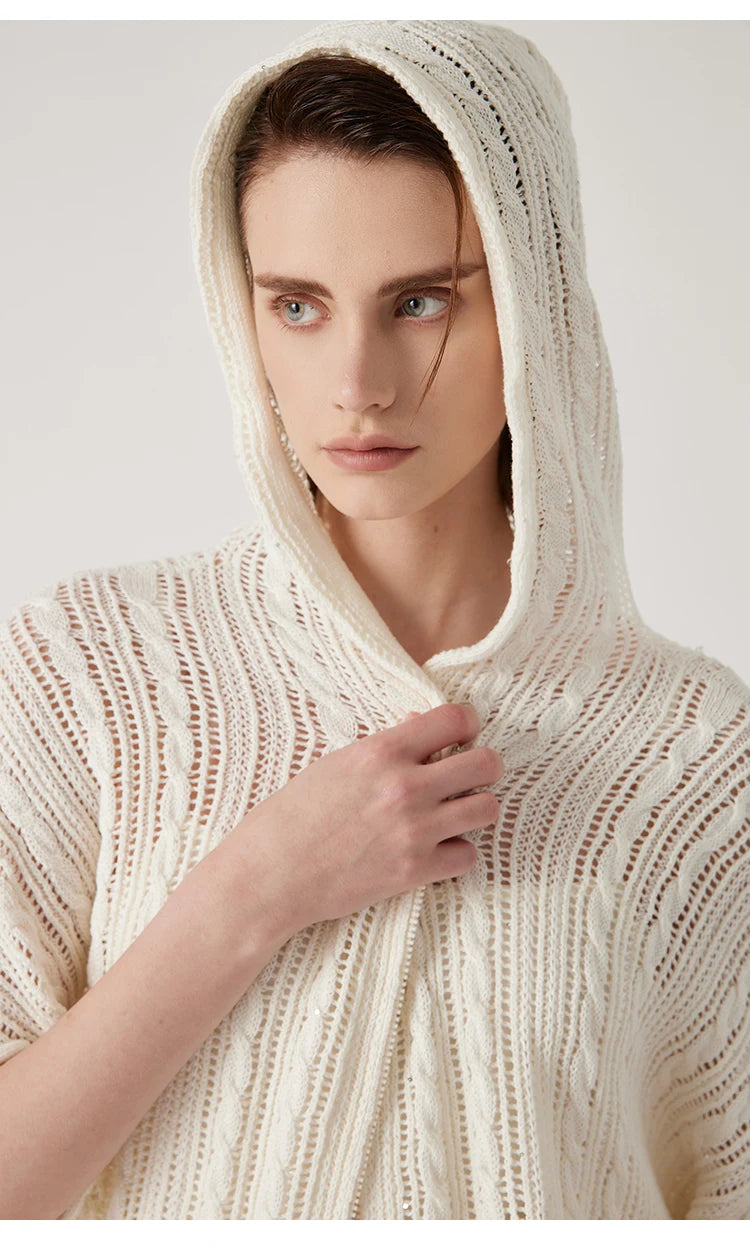 Woman wearing a pearl bush lace hoodie with hood lifted, accentuating the lightweight fabric and relaxed silhouette. From Borcelleclothes.