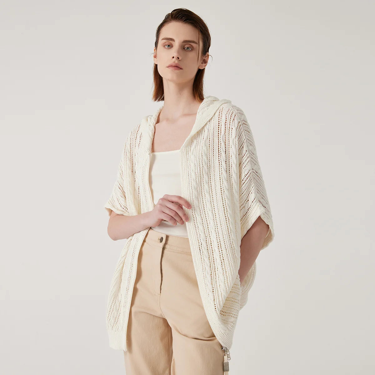 Women's linen lace hoodie in Pearl Bush featuring a translucent knit, braided stitches, a zipper front, and a relaxed hood. From Borcelleclothes.