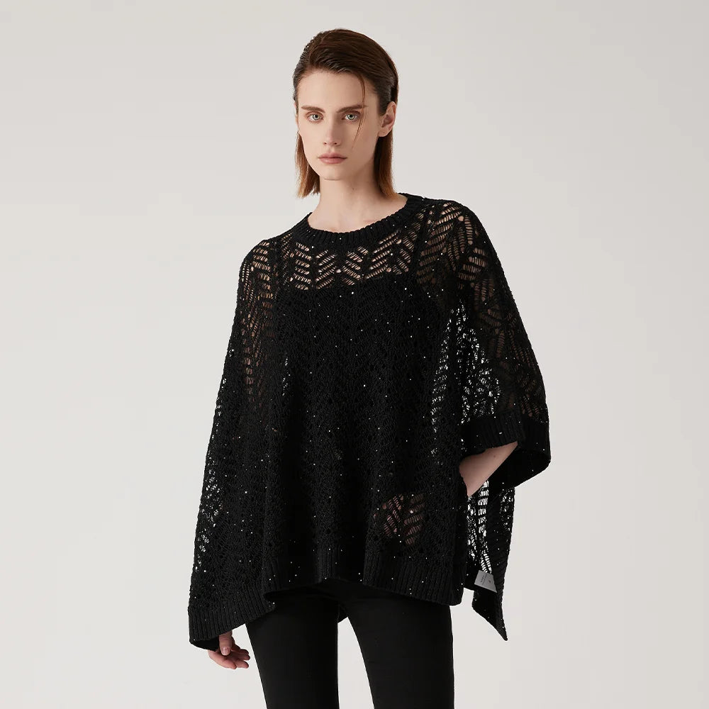 Women's linen lace poncho in Onyx - in an airy rectangular cut with abstract openwork knit, silver sequin accents, and underarm tacking for sculpted drape. From Borcelleclothes.