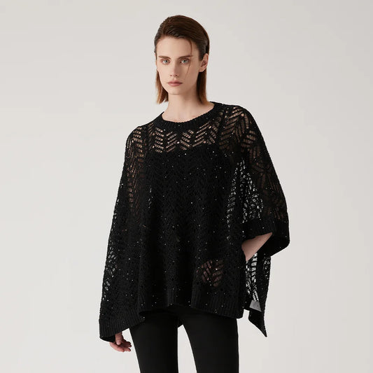 Women's linen lace poncho in Onyx - in an airy rectangular cut with abstract openwork knit, silver sequin accents, and underarm tacking for sculpted drape. From Borcelleclothes.