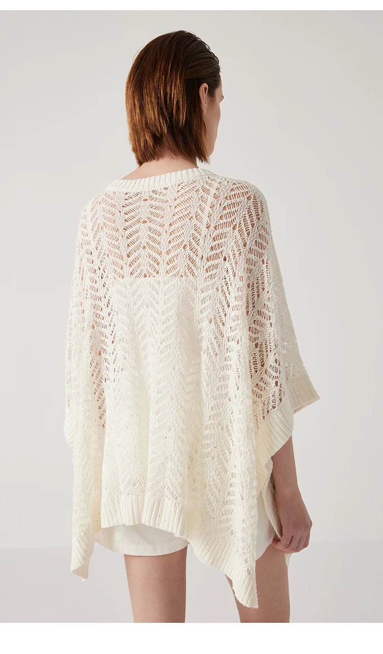 Back view of Pearl Bush poncho, open lace pattern and straight cut forming a serene, weightless outline. From Borcelleclothes.