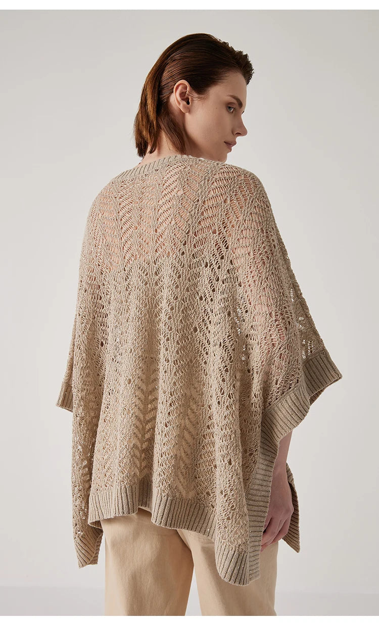 Back view of Vanilla linen poncho, structured rectangle softened by light and open branch-like knit. From Borcelleclothes.