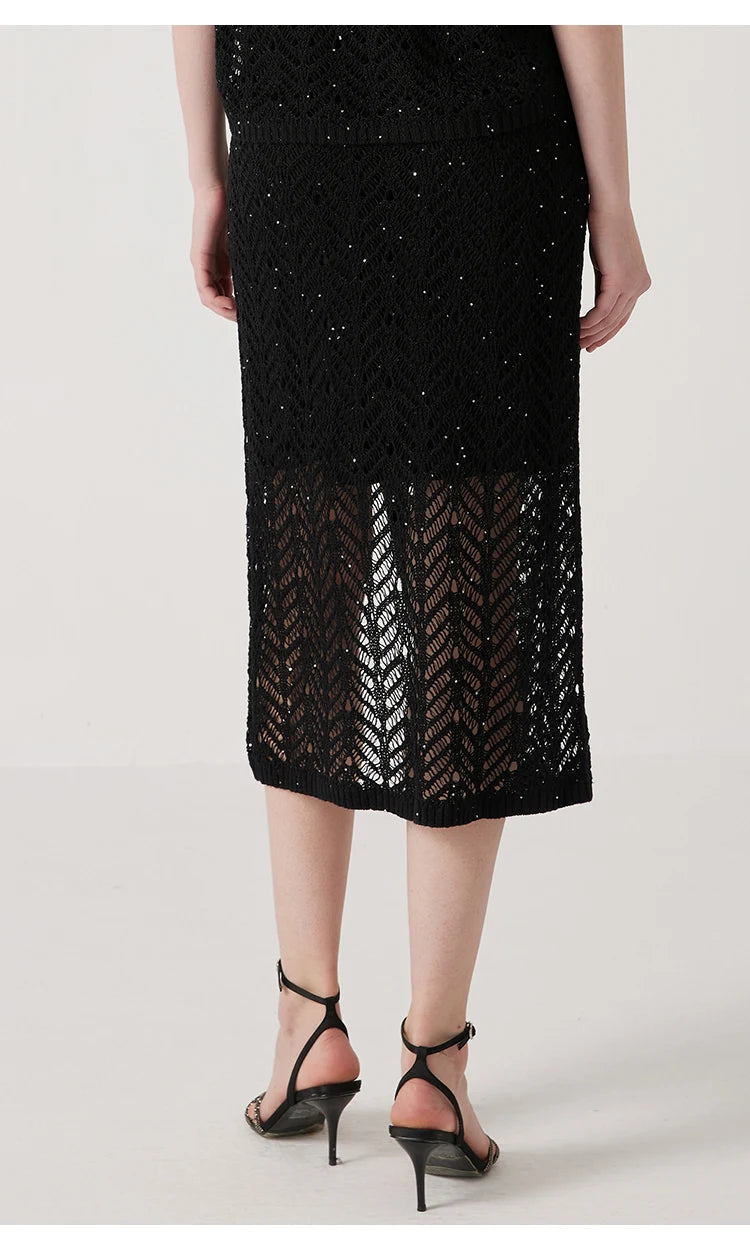 Back view of the model wearing the Onyx linen lace skirt, displaying the elegant wrap and drape. From Borcelleclothes.