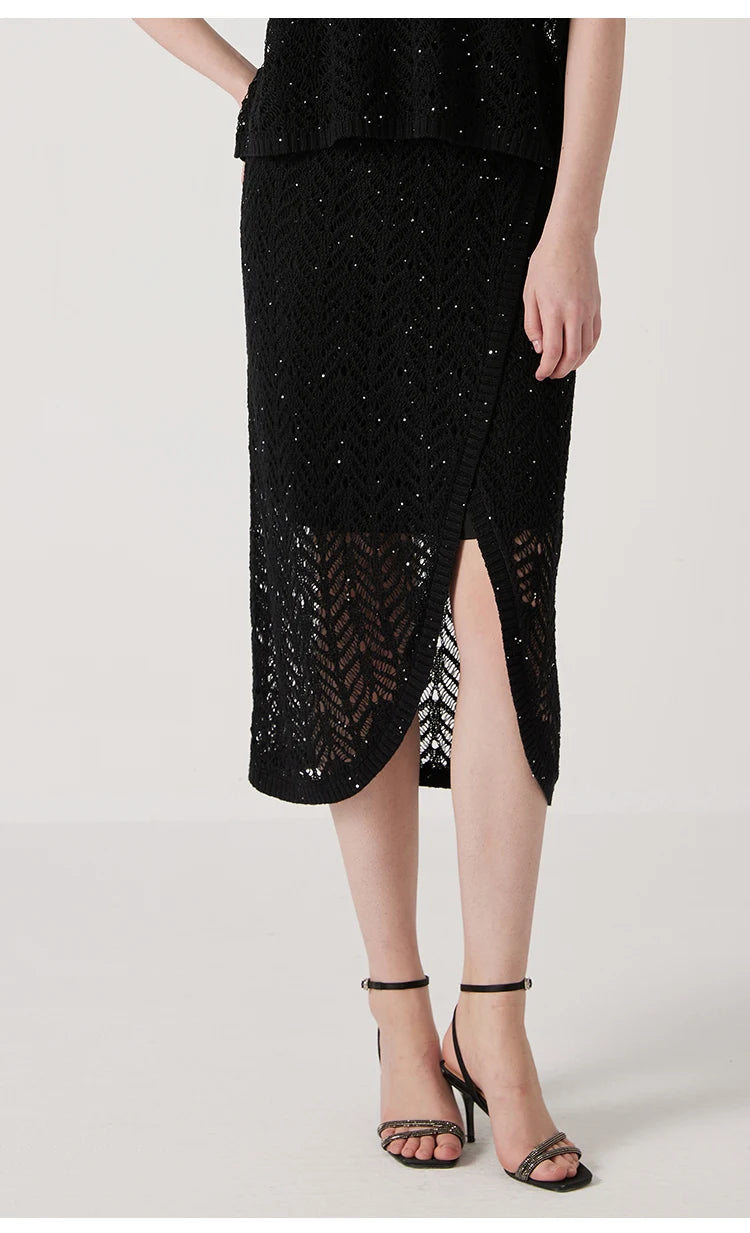 Model in Onyx linen lace skirt with one leg slightly bent, capturing the dynamic flow of the lace fabric. From Borcelleclothes.