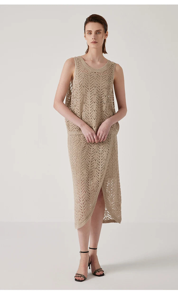 Model in Vanilla linen lace skirt gently touching her hands, capturing the soft rhythm of the design. From Borcelleclothes.