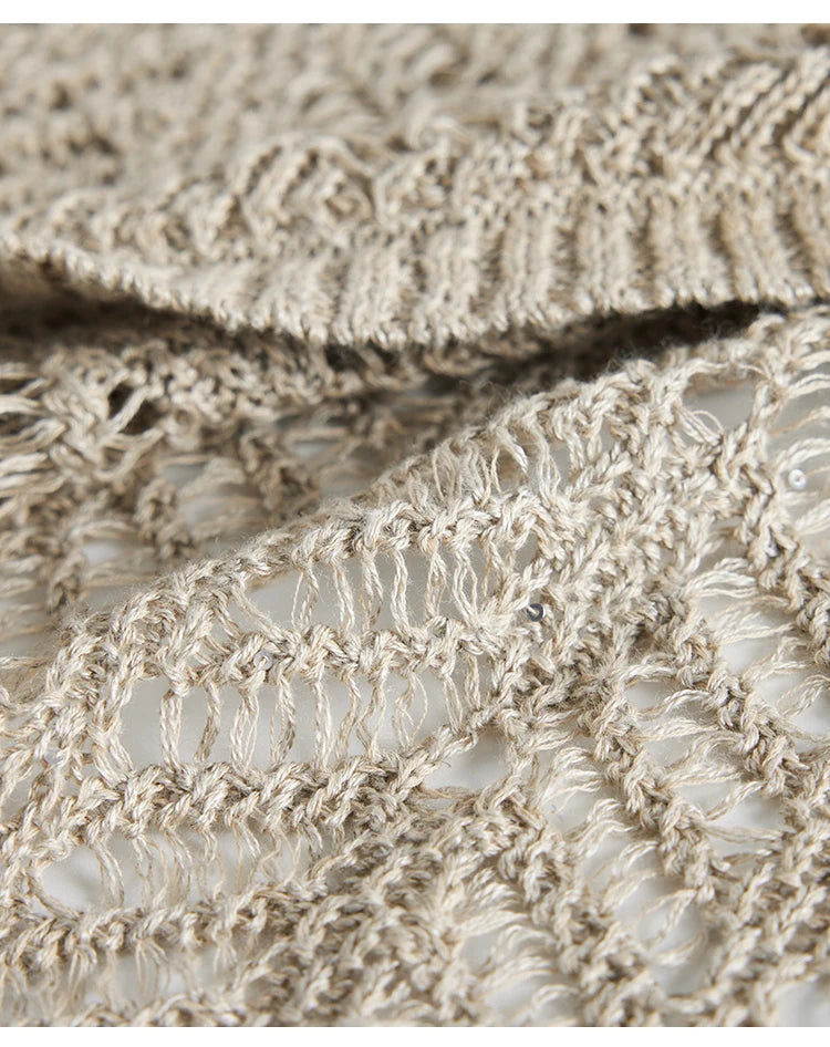 Macro view of the Vanilla linen lace knit, revealing the abstract branches motif and breathable texture. From Borcelleclothes.