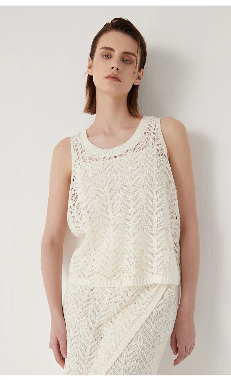 Model standing with arms straight, showing the Pearl Bush lace-knit top. From Borcelleclothes.