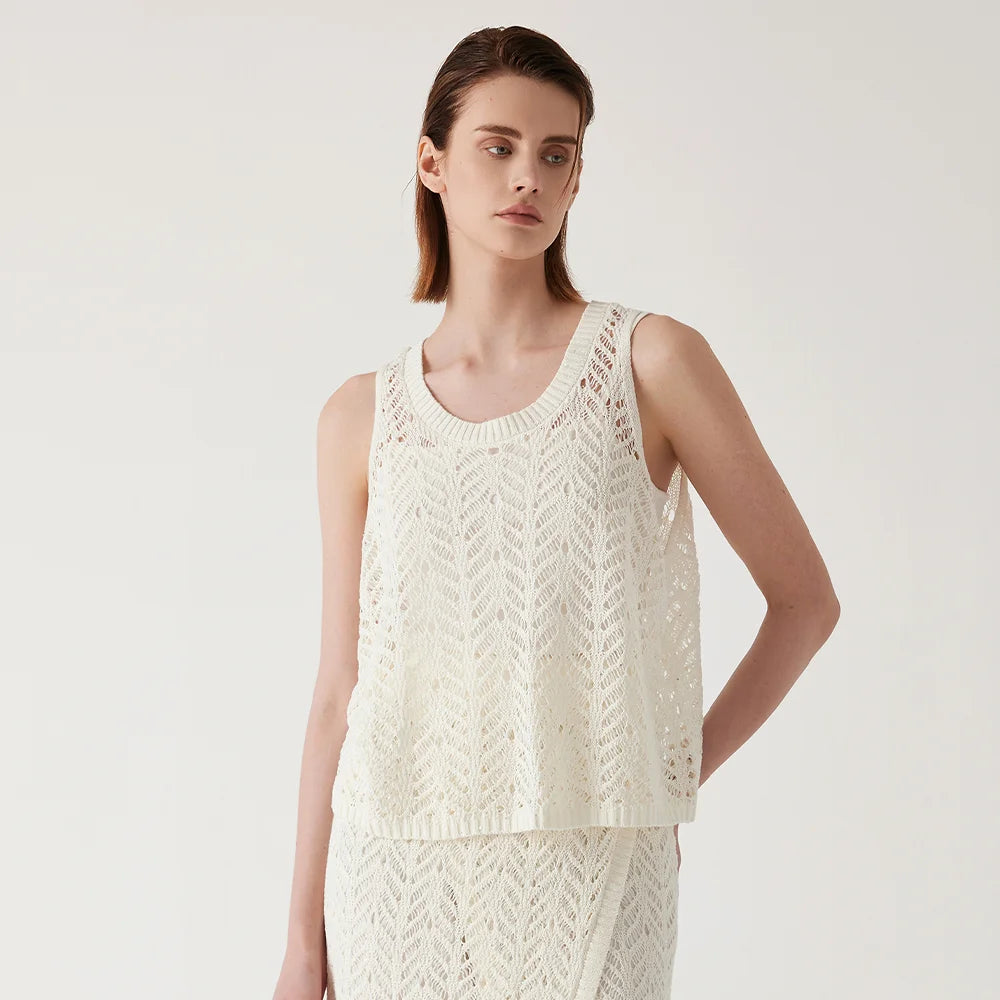 Women's Linen top in Pearl Bush with wide ribbed neckline and airy openwork pattern, combining festive lightness with sculptural elegance. From Borcelleclothes.