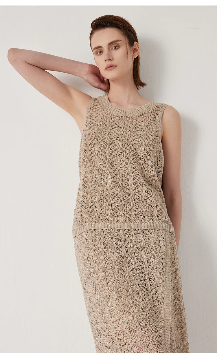 Model touching neck, drawing attention to the wide rib neckline of the Vanilla top. From Borcelleclothes.