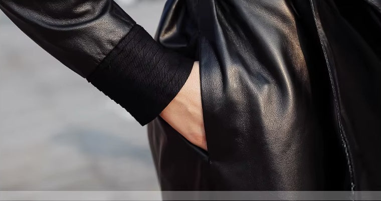 Women's Long Quilted Coat: Nightfall Embrace in Leather & Suede. Close-up showcasing the discreet hidden seam pockets, preserving the coat’s uninterrupted flow. Borcelleclothes.