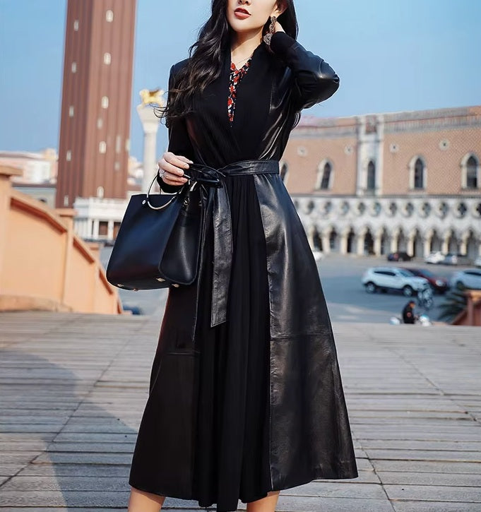 Women's Long Quilted Coat: Nightfall Embrace in Leather & Suede. Model gently touches her hair, highlighting the high neckline and sculpted form. Borcelleclothes.