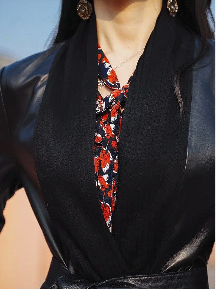 Women's Long Quilted Coat: Nightfall Embrace in Leather & Suede. Close-up of the upper section, highlighting the dramatic high neckline and structured A-line silhouette. Borcelleclothes.