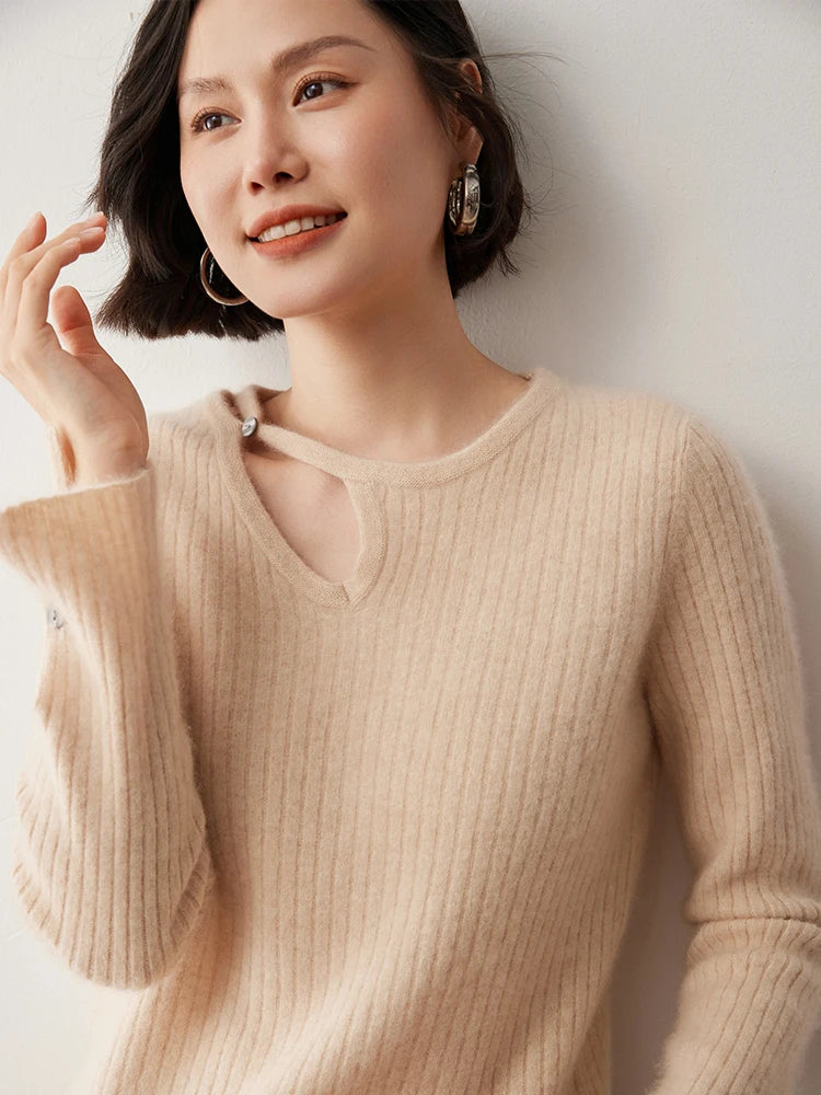 Loop neckline cashmere sweater in Almond with model’s arm bent — From Borcelleclothes.