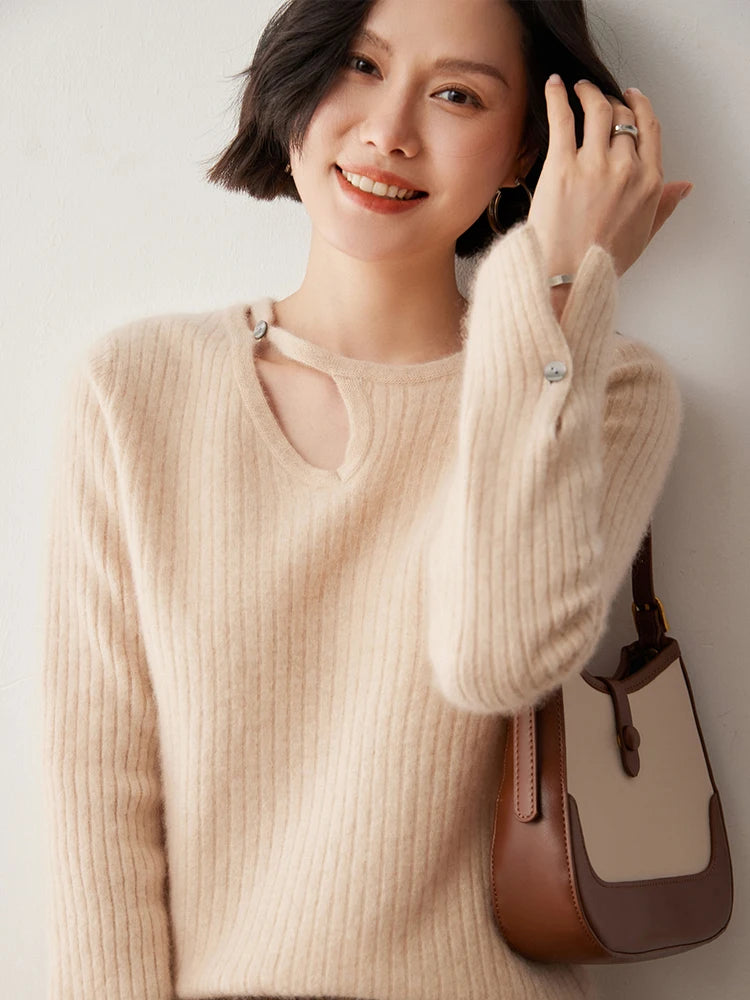Loop neckline cashmere sweater in Almond with model touching hair — From Borcelleclothes.