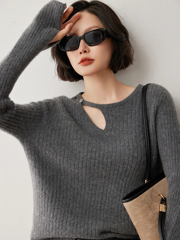 Loop neckline cashmere sweater in Davy Grey with model touching forehead — From Borcelleclothes.
