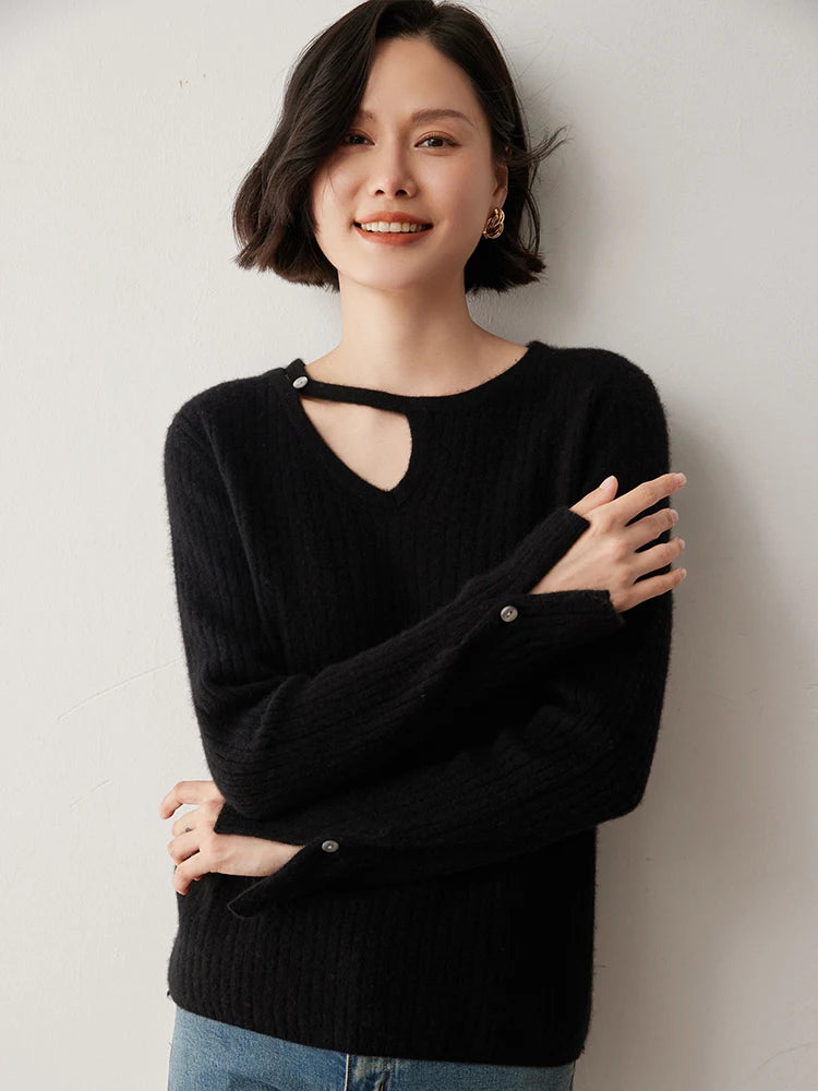 Loop neckline cashmere sweater in Onyx with model resting hand on opposite arm — From Borcelleclothes.