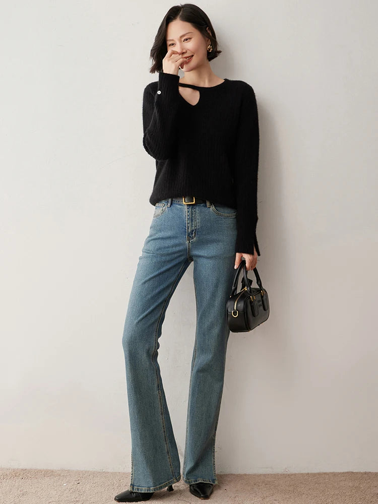 Loop neckline cashmere sweater in Onyx with model gently touching nose — From Borcelleclothes.