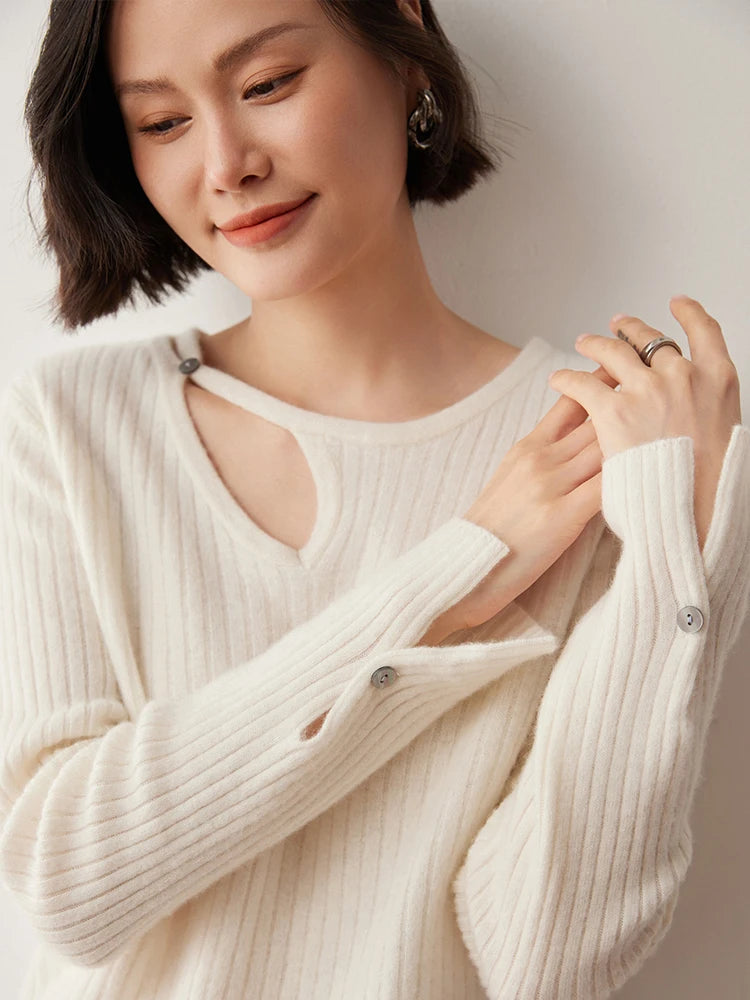 Loop neckline cashmere sweater in Pearl Bush with model touching fingertips — From Borcelleclothes.