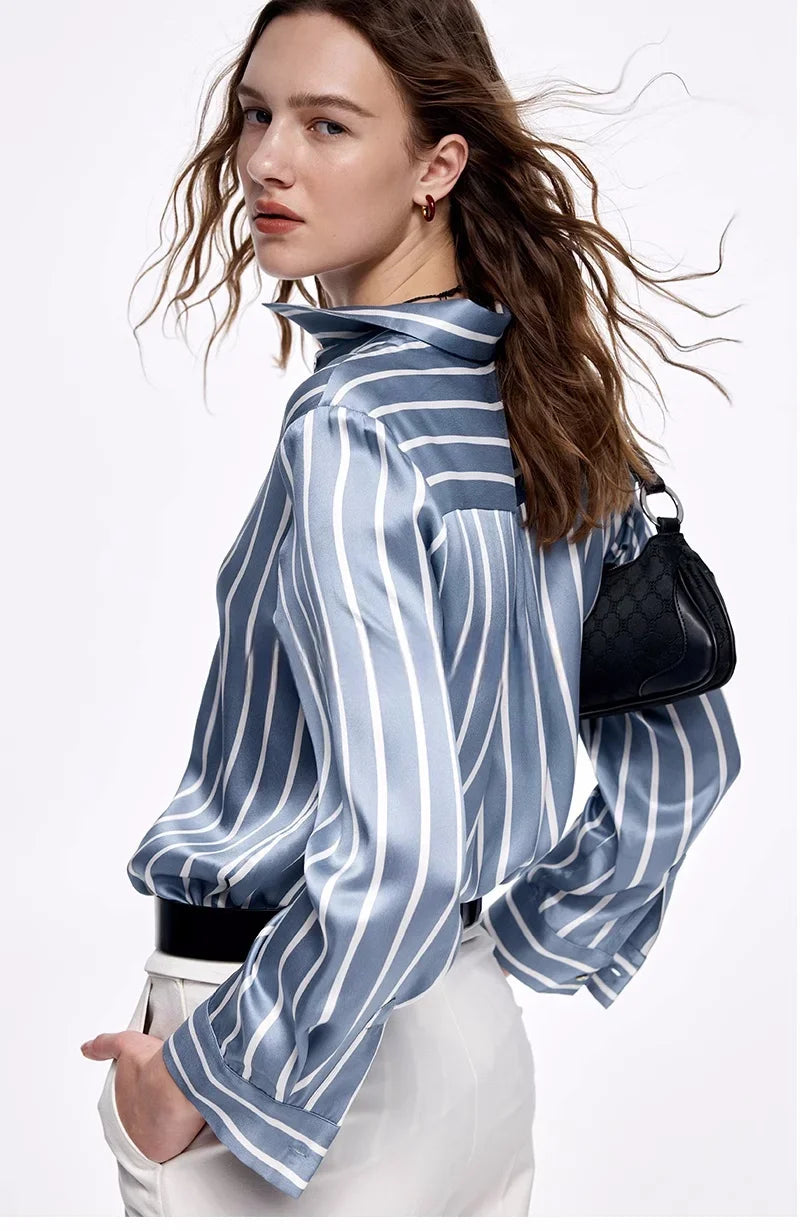 The back of the Women's Luxury 6A Mulberry Silk Shirt in Striped Light Blue Grey & White – Premium 100% Mulberry Silk with a Relaxed, Pajama-Inspired Silhouette for Effortless Elegance. From Borcelleclothes.