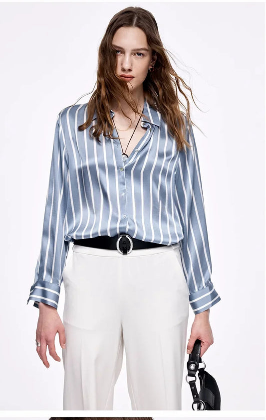 The front of the Women's Luxury 6A Mulberry Silk Shirt in Striped Light Blue Grey & White – Premium 100% Mulberry Silk with a Relaxed, Pajama-Inspired Silhouette for Effortless Elegance. From Borcelleclothes.