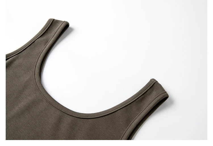 Close-up of the scoop neckline of the Makara sleeveless knit dress. From Borcelleclothes.