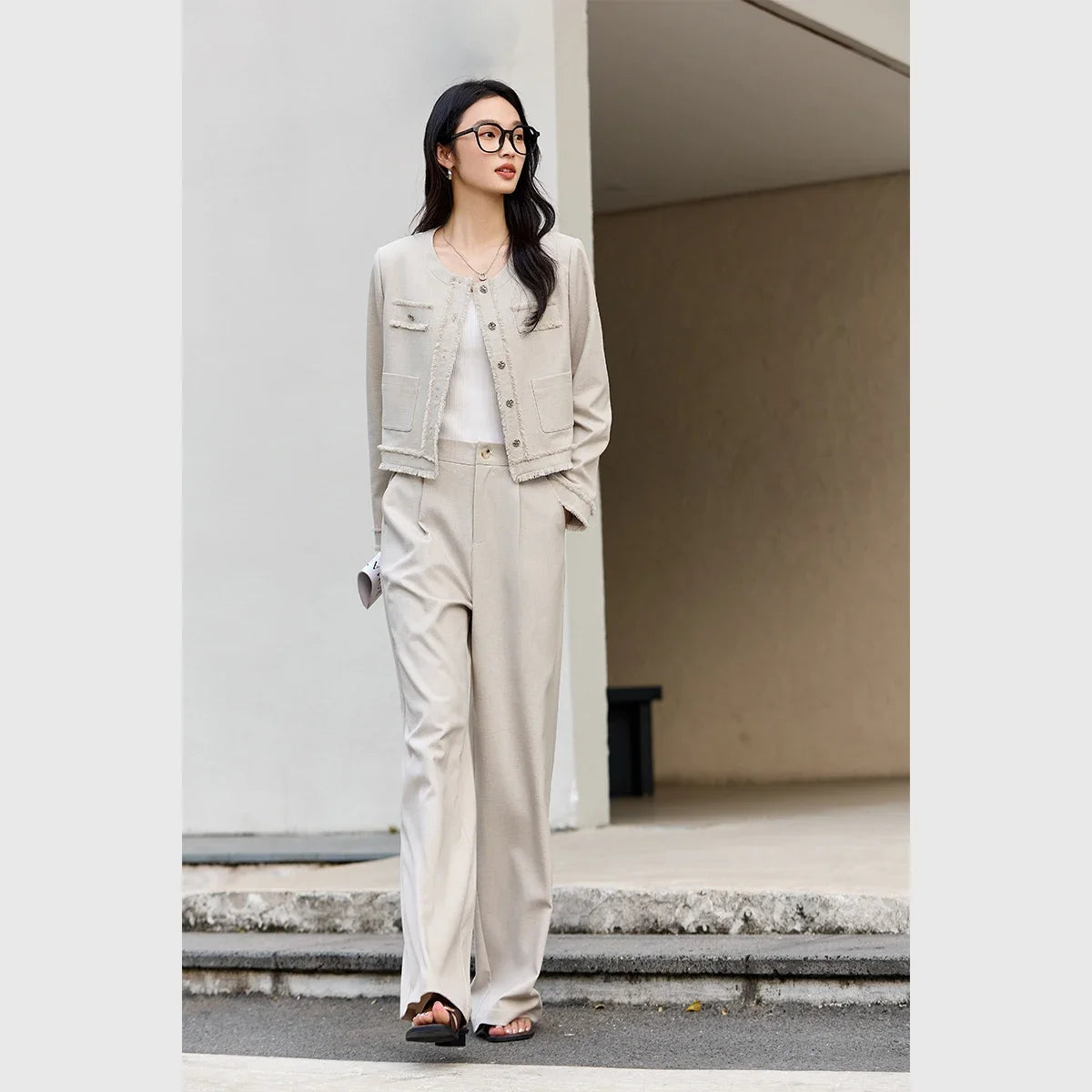 Model confidently stepping forward in the Martini two-piece set, trousers in motion. From Borcelleclothes.