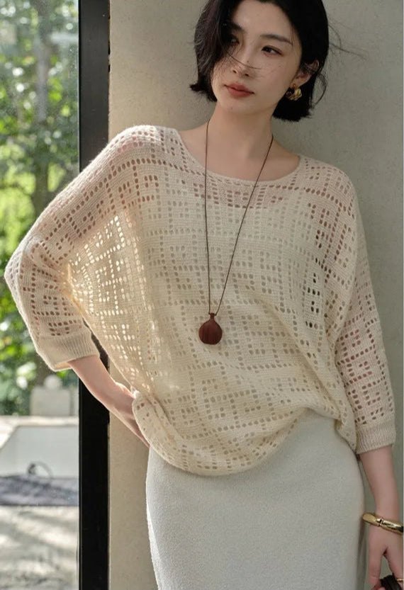 Model resting hand on hip in the Pearl Bush Meander cashmere top – From Borcelleclothes.