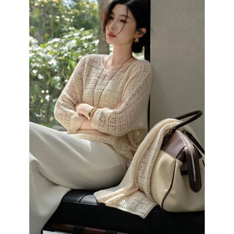 Seated model with arms crossed in the Pearl Bush Meander cashmere top – From Borcelleclothes.