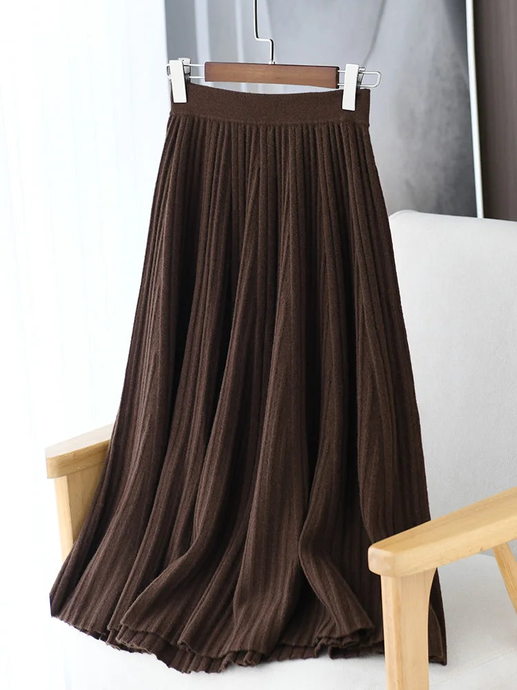 Merino skirt with textured pleats in Royal Brown on hanger — From Borcelleclothes.