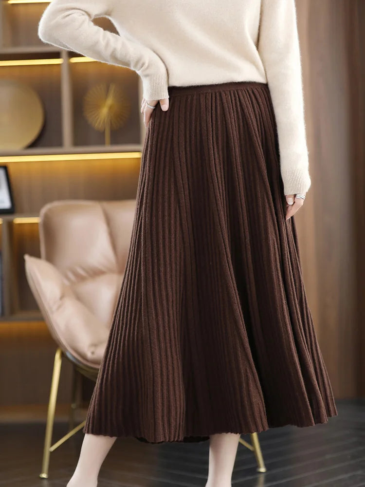 Women's merino skirt in Royal Brown, with textured pleats in soft wool, designed to create the illusion of layered volume and flowing lightness — From Borcelleclothes.