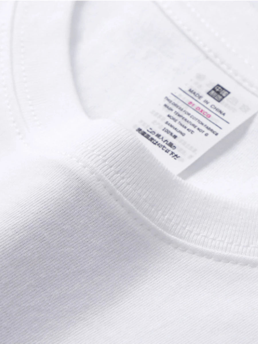 Detailed stitching on the ribbed binding of the crew neck in our Women's Mid-Weight Cotton T-Shirt in White. This t-shirt features a slightly oversized fit, classic crew neck, and short sleeves. Made from cozy, mid-weight fabric, it offers comfort and versatility, perfect for cooler days and casual styling. Available in 11 colors. From Borcelleclothes.