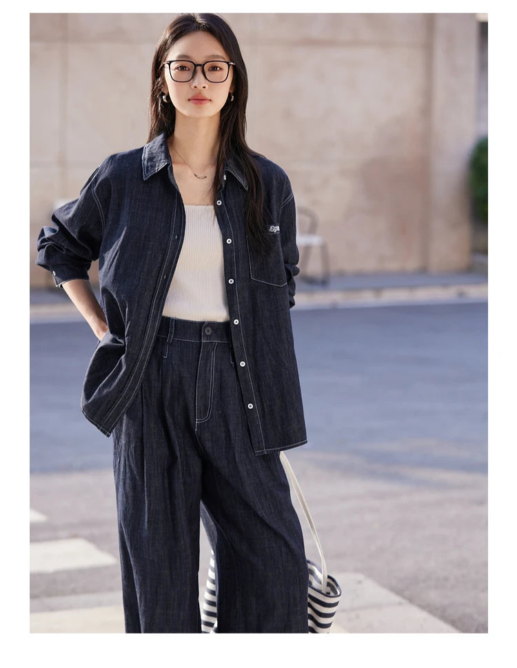Model in Midnight Express set with hand on hip — showcasing dropped shoulder shirt and relaxed tucks trousers. From Borcelleclothes.