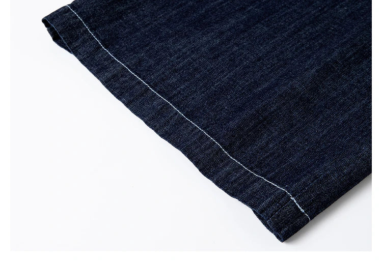 Close-up of trousers hem — contrast stitching grounding the wide-leg cut in quiet definition. From Borcelleclothes.