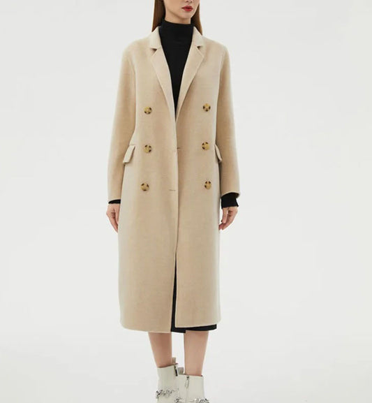 Women's Minimalist Long Wool Coat in Vanilla, featuring a double-breasted design with six buttons, notch lapels, side flap pockets, and a mid-calf length, crafted from 90% wool and 10% cashmere for timeless warmth and understated elegance. From Borcelleclothes.