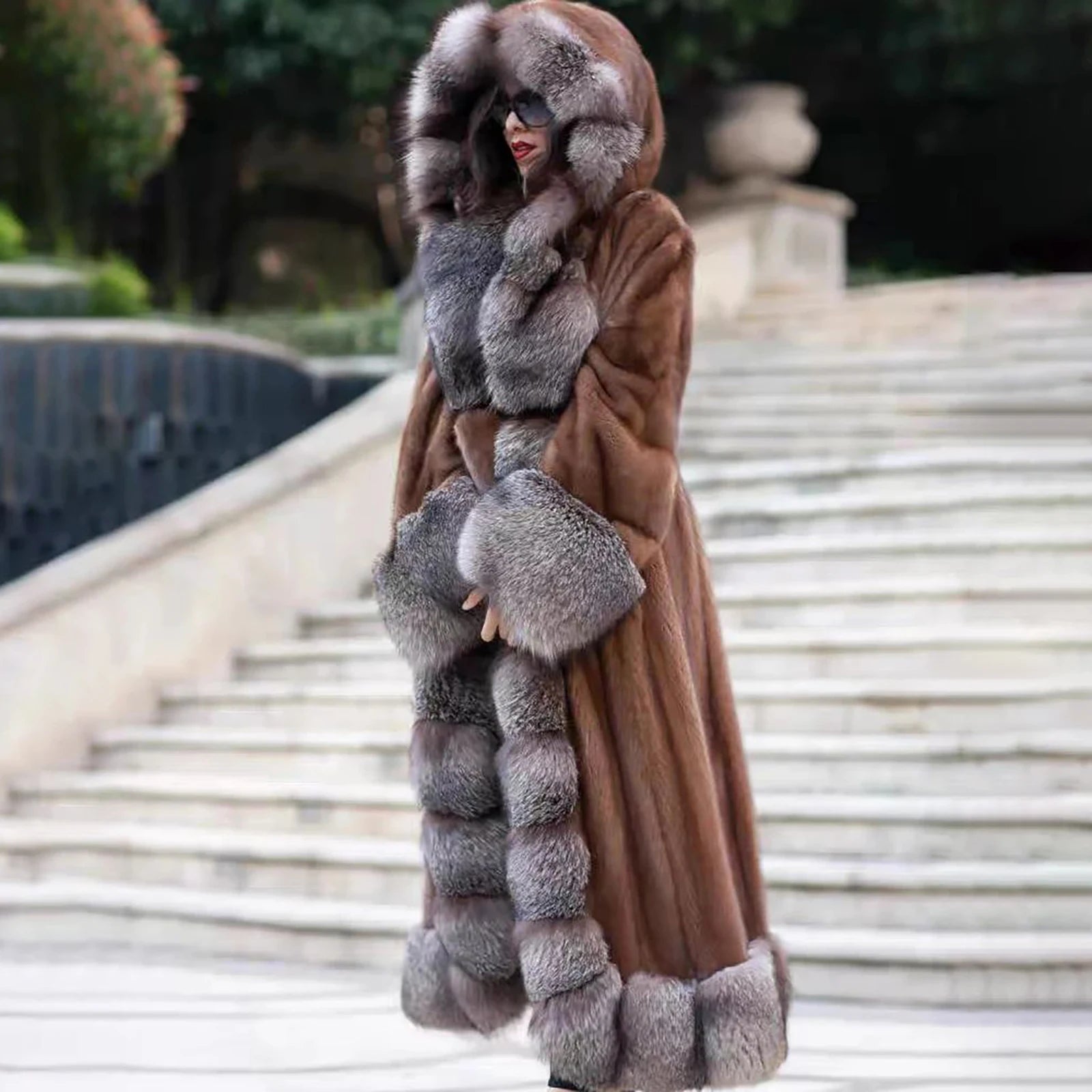 A side profile of a model draped in a Women's Mink & Crystal Fox Fur Coat, where the flowing mink fur meets the structured richness of Crystal Fox, creating a silhouette of quiet luxury. From Borcelleclothes.