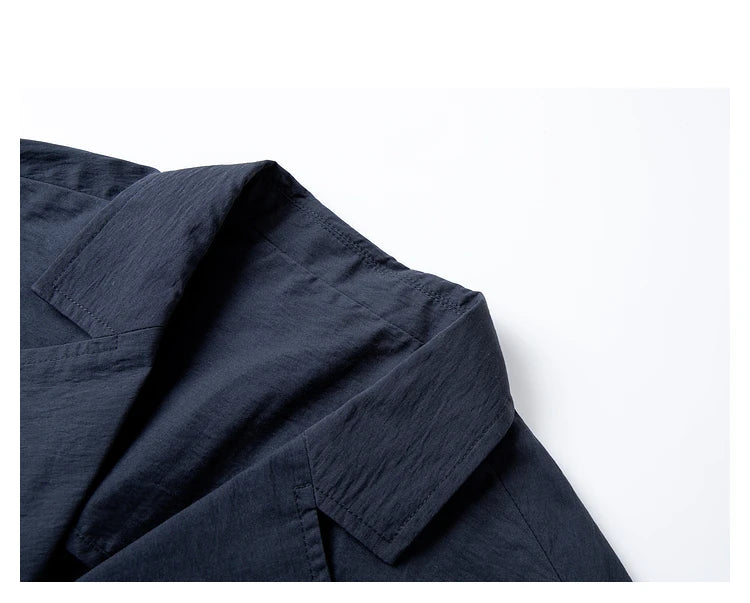 Close-up of jacket collar in Mirage color — notched lapels adding definition to the structured silhouette. From Borcelleclothes.