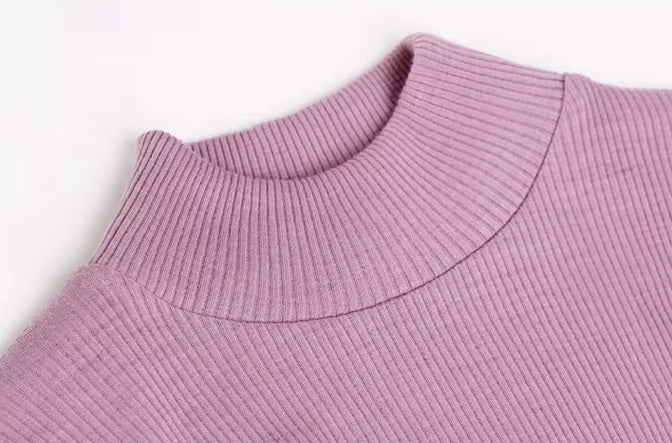 Textured fabric on the mock collar of a Women's Mock Neck Wool Top in Lily color, crafted from 100% wool for chic style and seasonal flexibility. From Borcelleclothes.